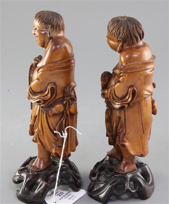 A pair of Chinese boxwood figures of Liu Hai, 19th century, height 21cm